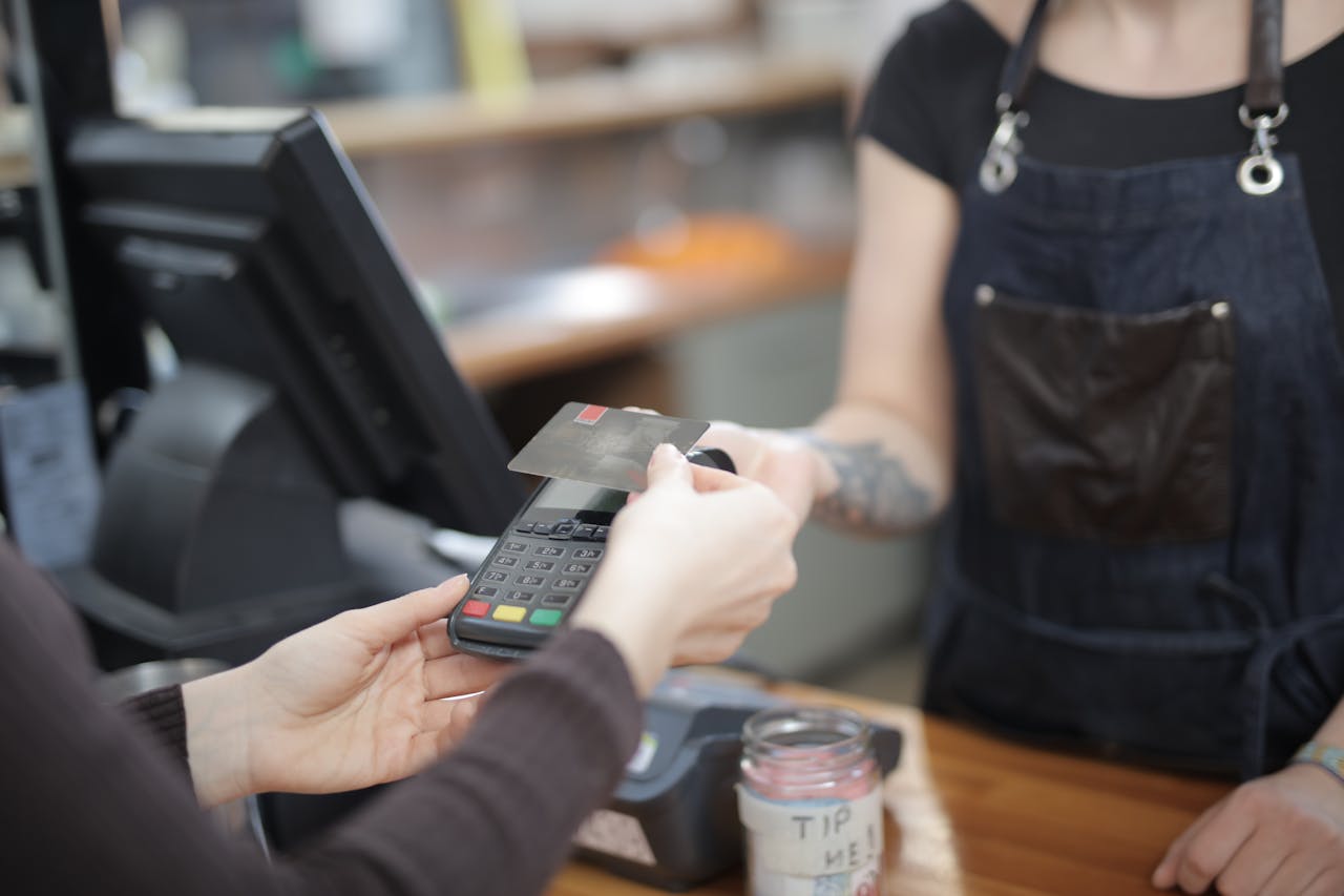 Retail employee using POS software to manage sales and inventory